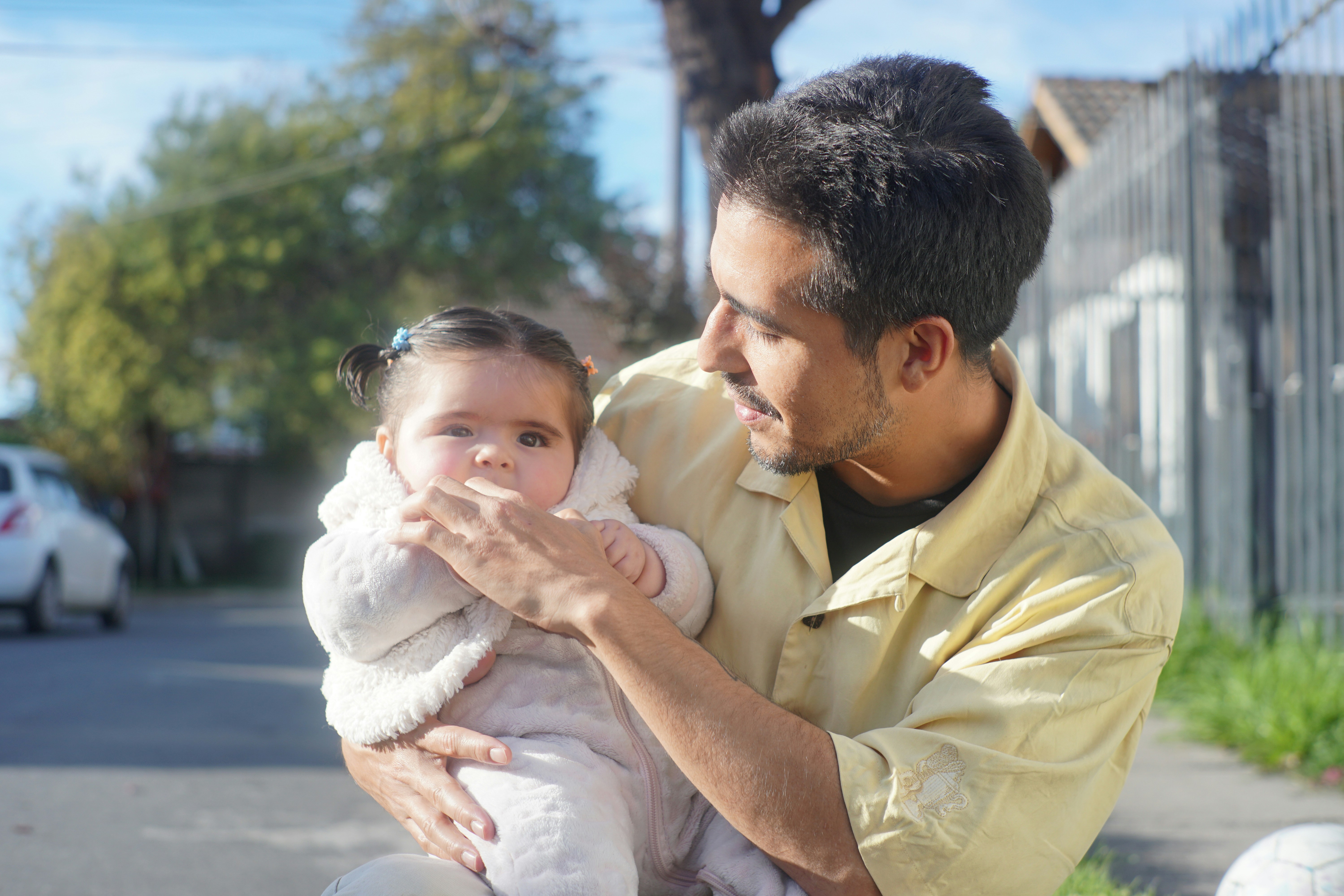 Keywords:
father working from home with child - Father holds his adorable baby in the sunlight.