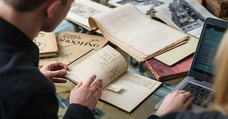 person writing book review on laptop - Library, Museums and Press launches new digital collections portal ...