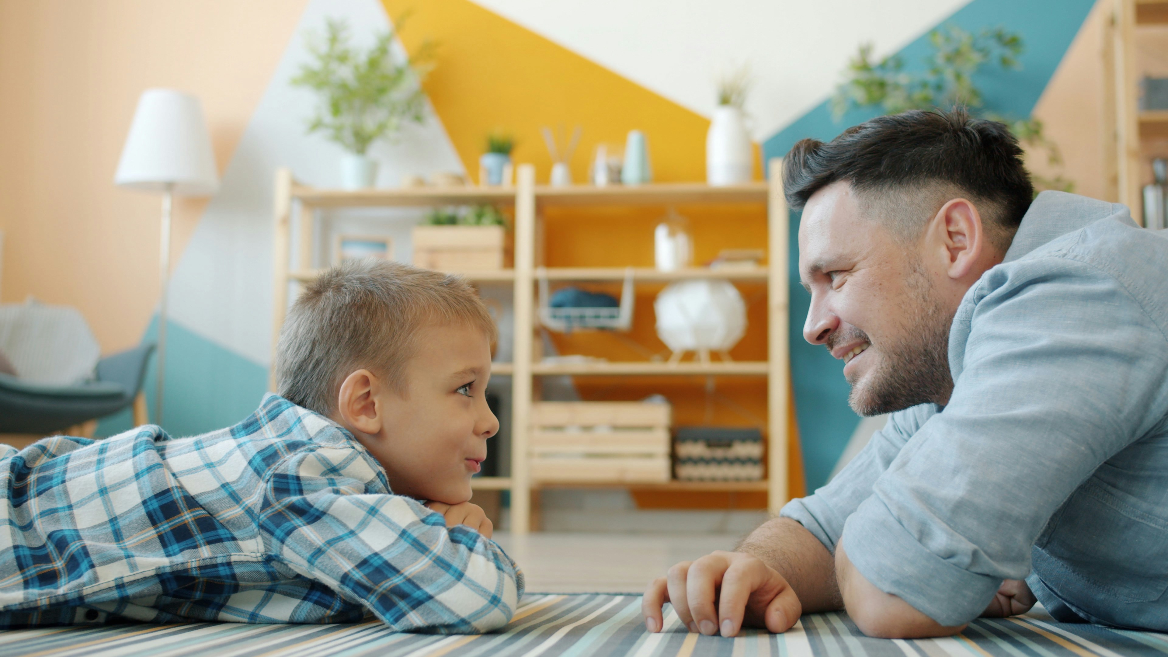 Keywords:
father working from home with child - Happy family middle-aged father and cute little son talking laughing smiling lying on floor at home. Communication, emotions and childhood concept.