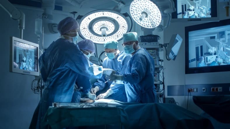 medical team operating theatre - Medical Team Performing Surgical Operation in Modern Operating ...